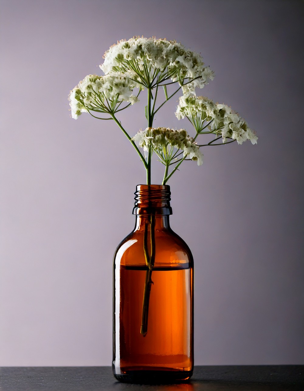 Amber Glass Bottle with Single Stem Blooms