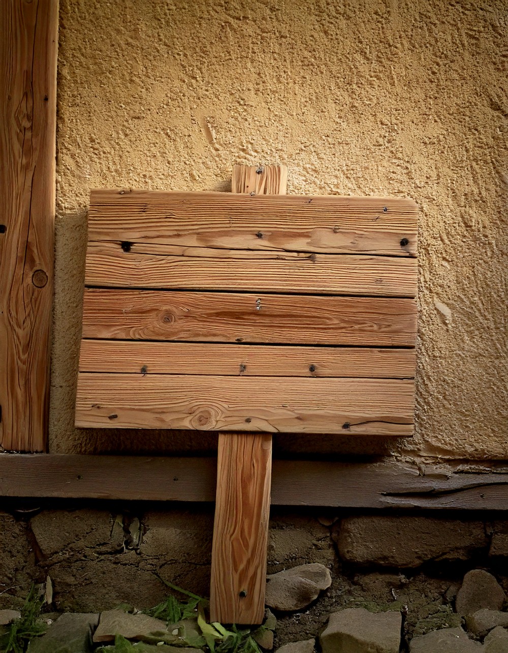 Rustic Wooden Sign Leaned Against the Wall