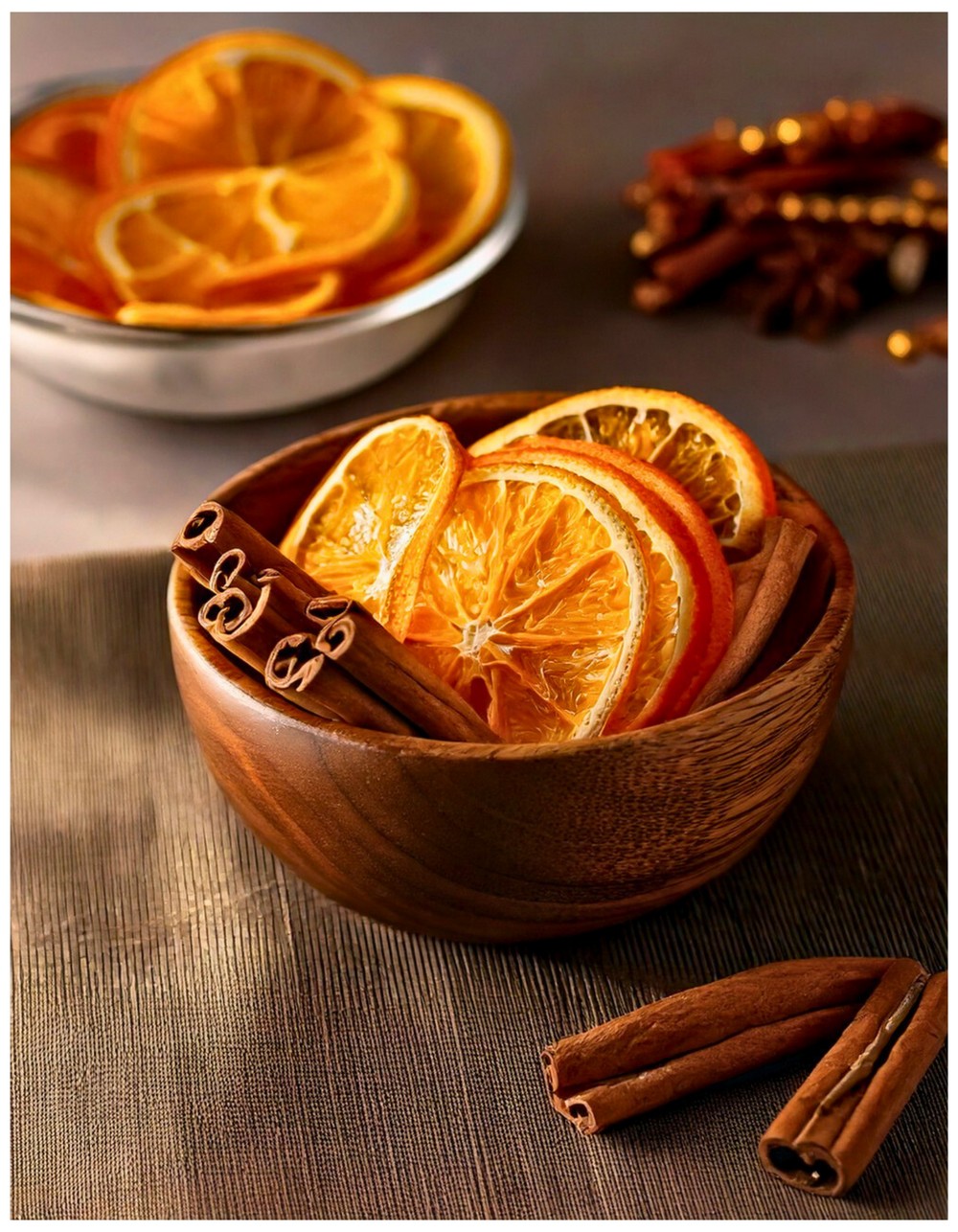 Bowl of Cinnamon Sticks and Dried Oranges