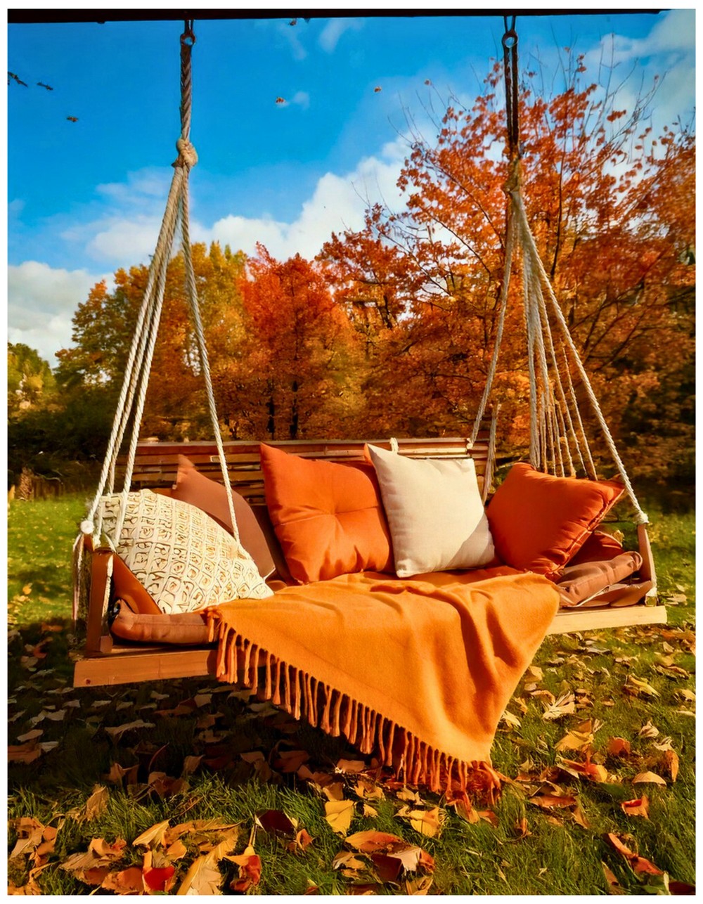 Swinging Daybed Draped in Autumn Pillows