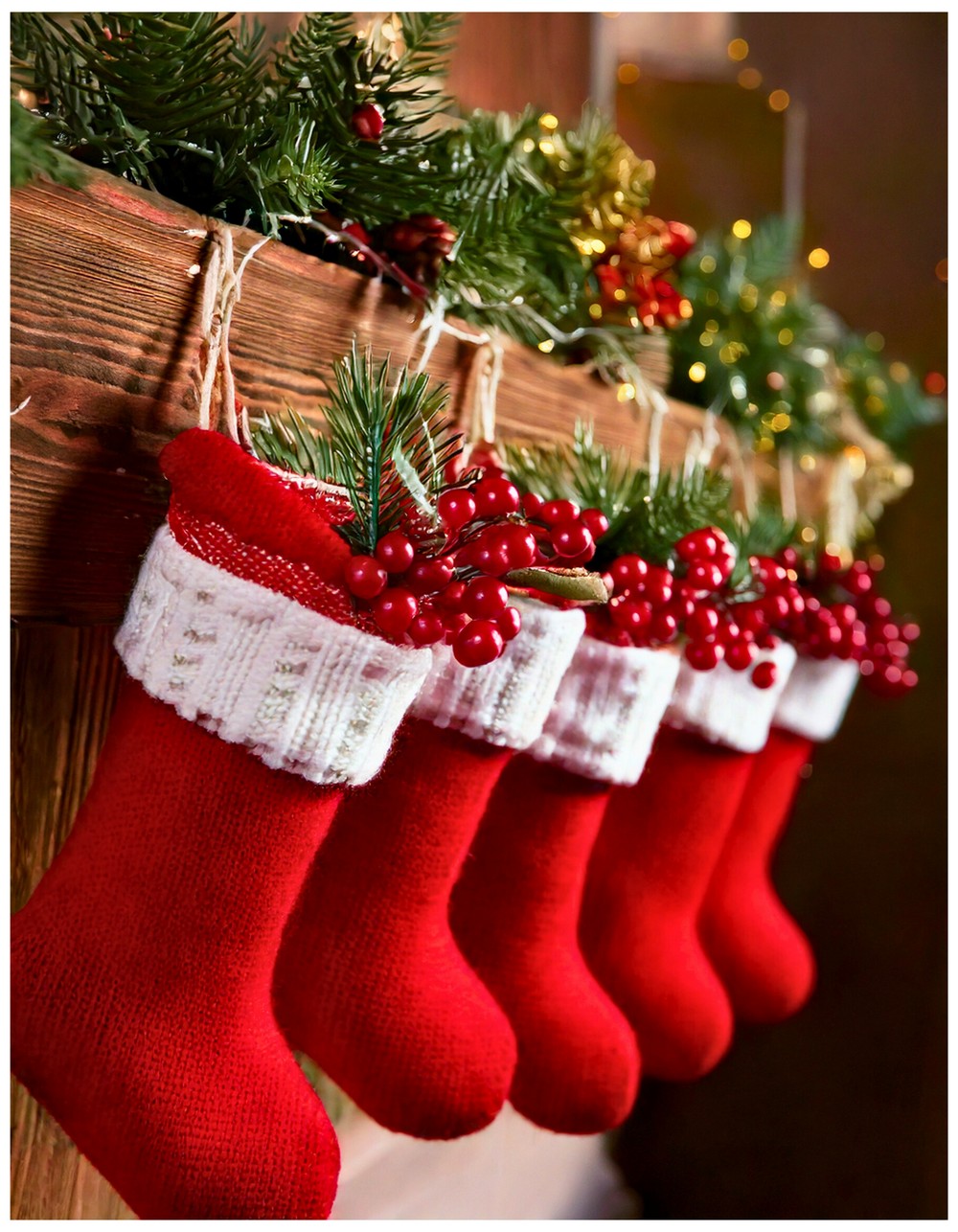 Wrap the stocking with a mini garland of faux cranberries and pine sprigs